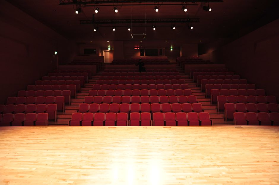 The Main Hall, empty, with its red seats
